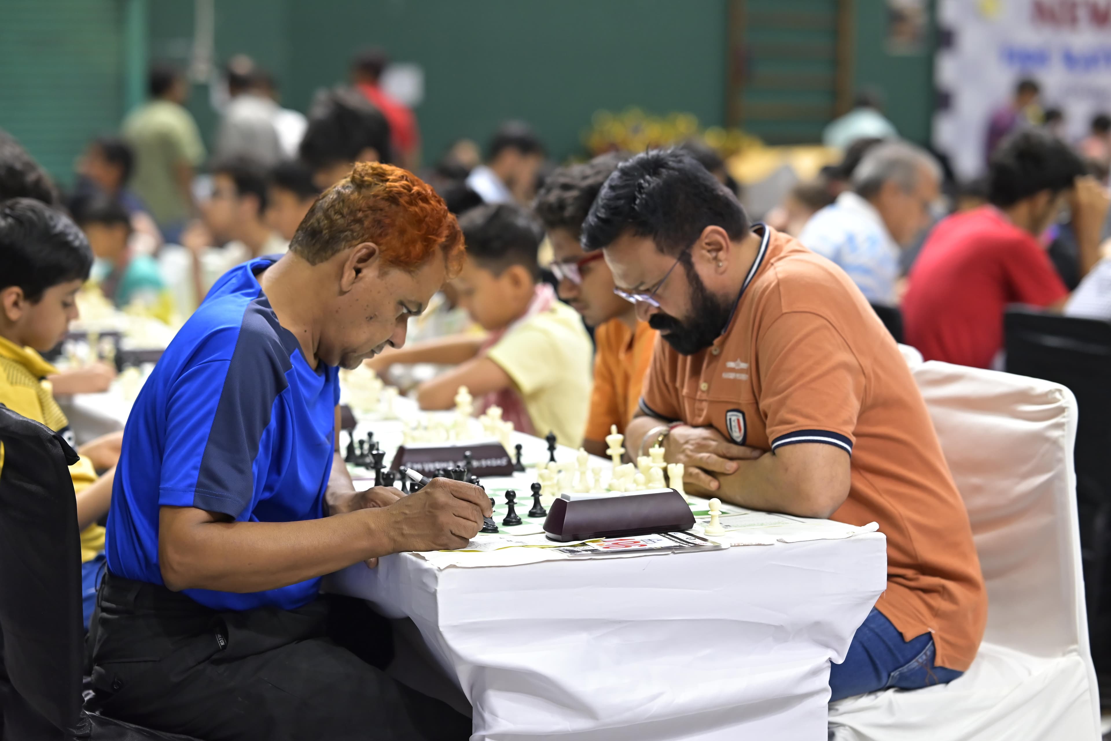 Tournament tables filled with chess players