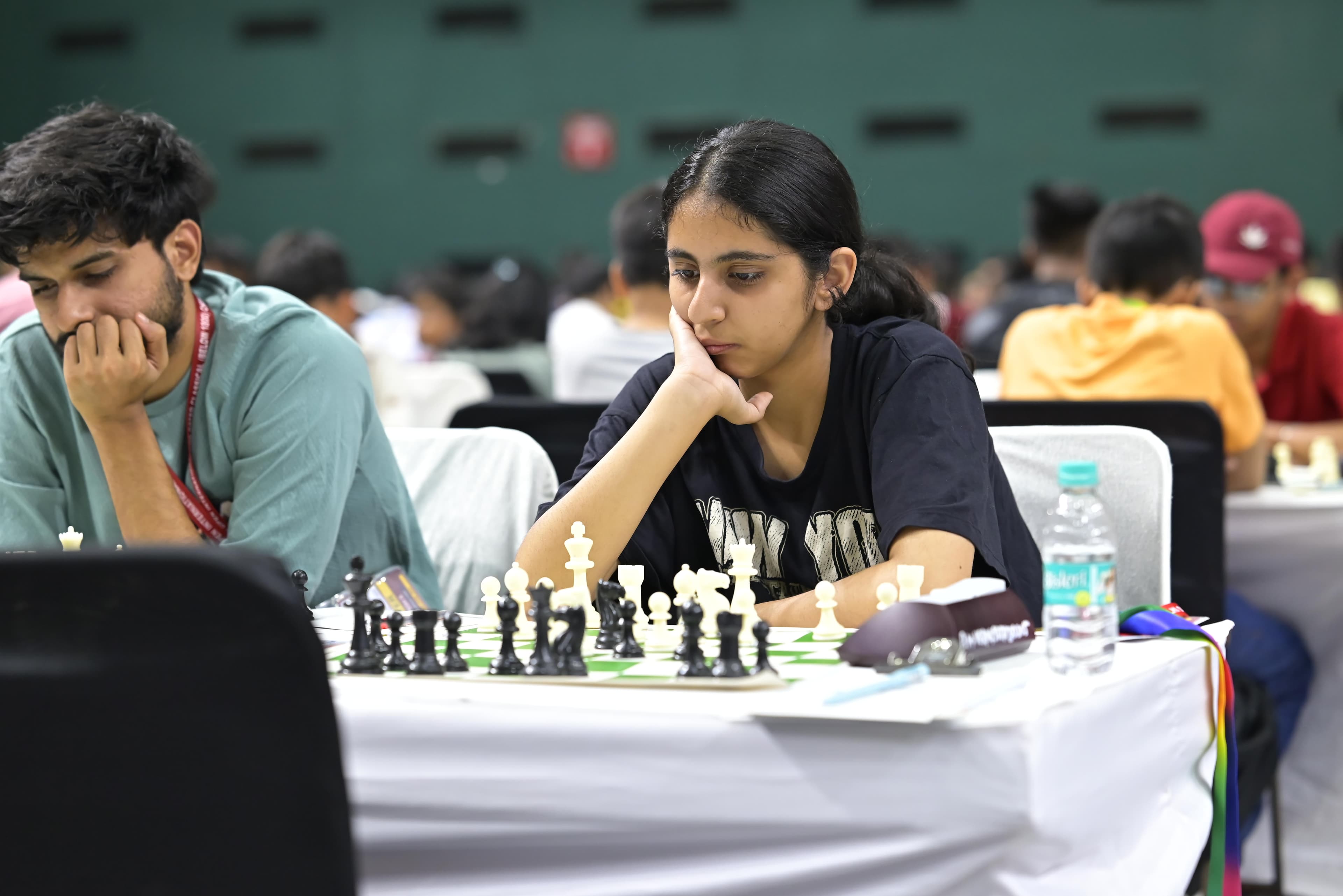 Young chess participant focused on the board