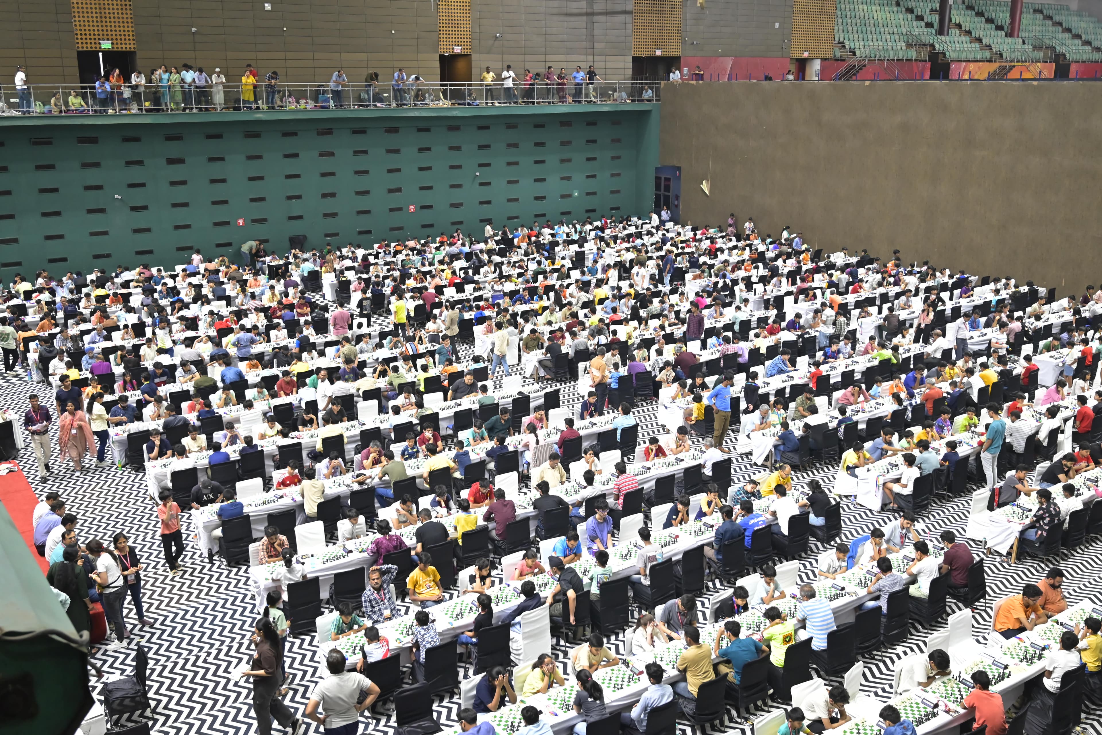 Large chess tournament hall filled with players
